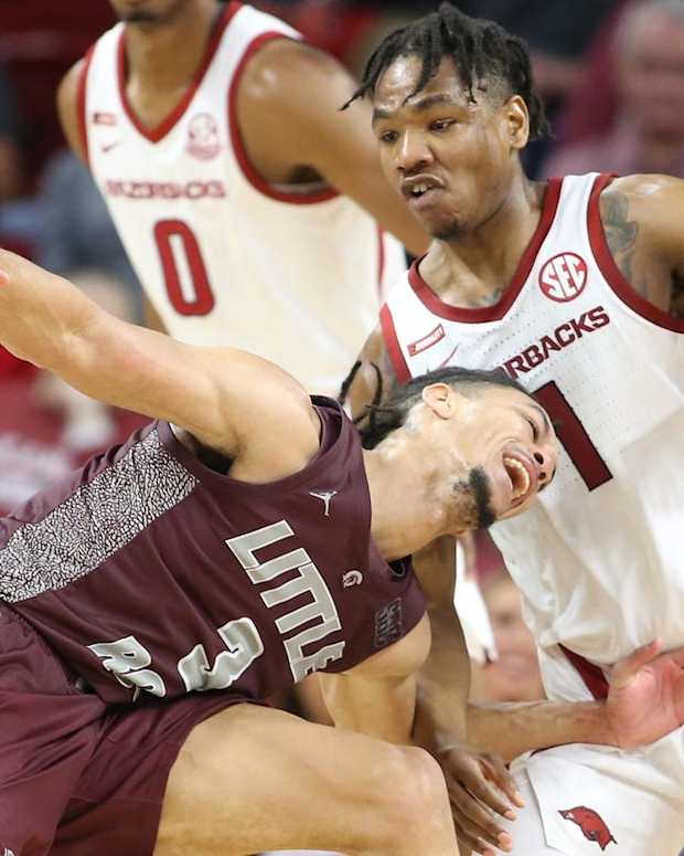Dec 4, 2021; Fayetteville, Arkansas, USA; Little Rock Trojans guard Isaiah Palermo (3) drives against Arkansas Razorbacks guard JD Notae (1) during the second half at Bud Walton Arena. Arkansas won 93-78. Mandatory Credit: Nelson Chenault-USA TODAY Sports